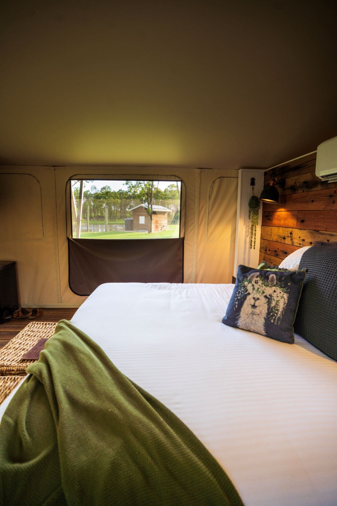 A bed in a Splitters Ram glamping tent in Bundaberg 