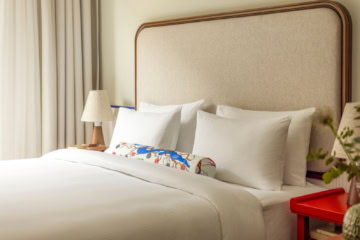 Bett im Deluxe Studio im Hotel Miiro Spittelberg