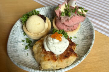 Essen in Graz: Häppchen auf einem Teller.