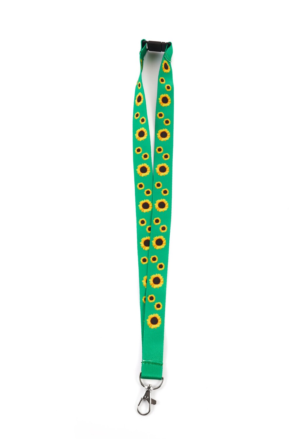 Grünes Schlüsselband mit gelben Sonnenblumen, schwarzem Sicherheitsverschluss und silbernem Karabiner vor weißem Hintergrund.