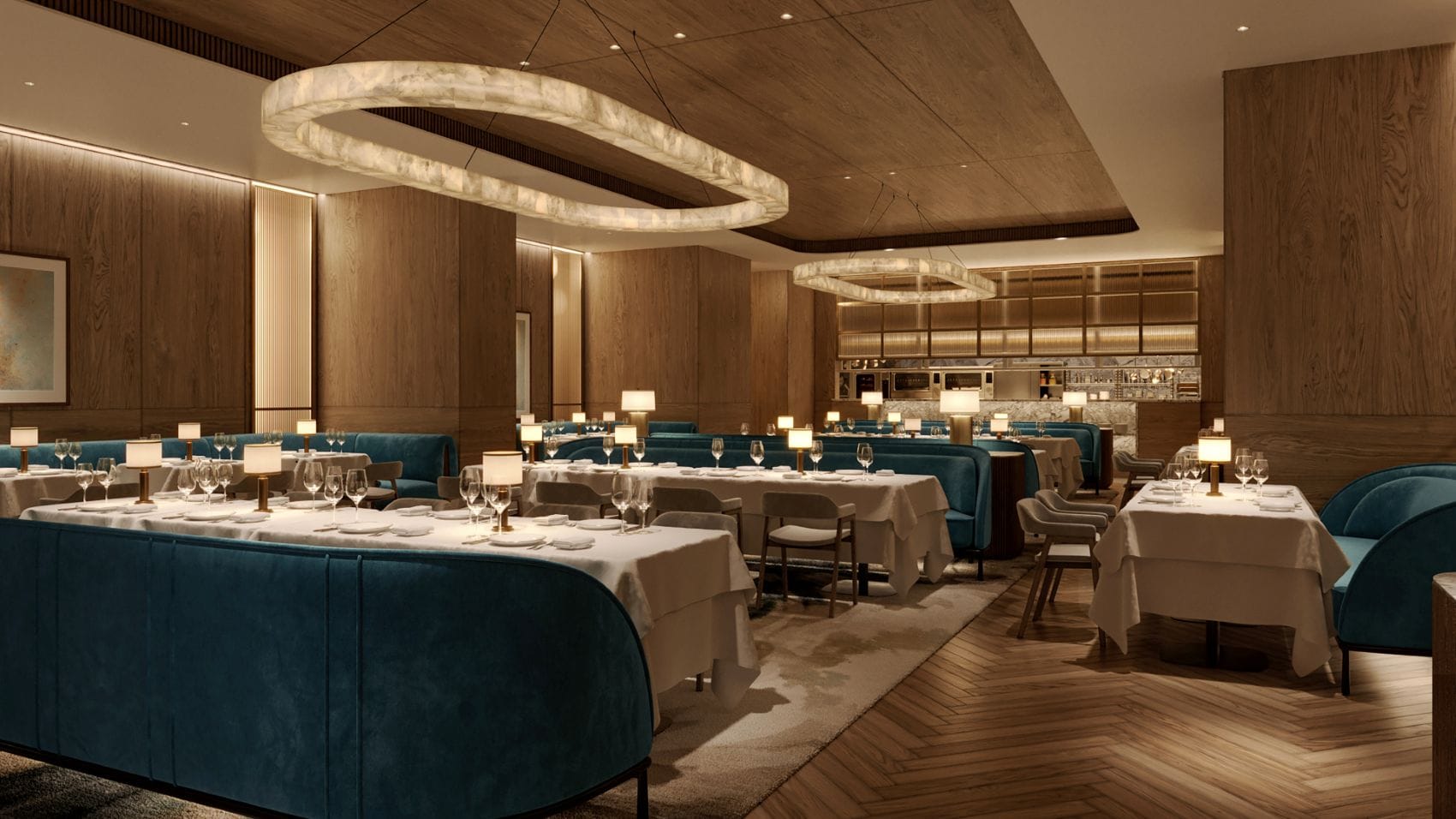 Restaurant JG KL im Waldorf Astoria Kuala Lumpur mit türkisblauen Sitzbänken, weiß gedeckten Tischen und ringförmigen Deckenleuchten.